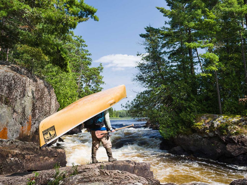 Guide Tim Barton Portaging a Canoe from Piragis Northwoods Company